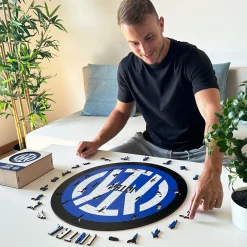 Inter Giochi E Peluches^IM PUZZLE DI LEGNO LOGO MARRONE